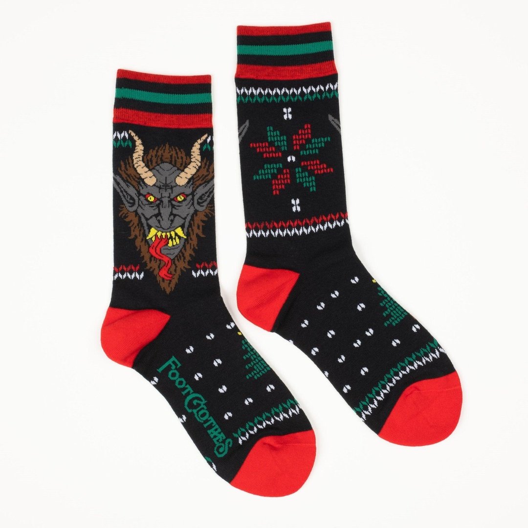 Pair of socks with a goblin design on a white background
