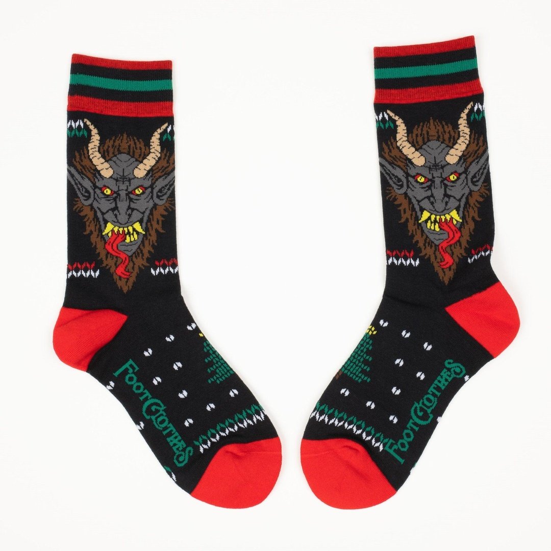 Pair of socks with a devil graphic design on a white background