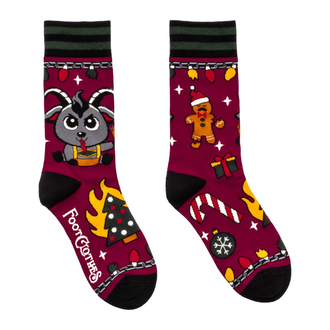 Colorful socks with cartoon Krampus design on a white background