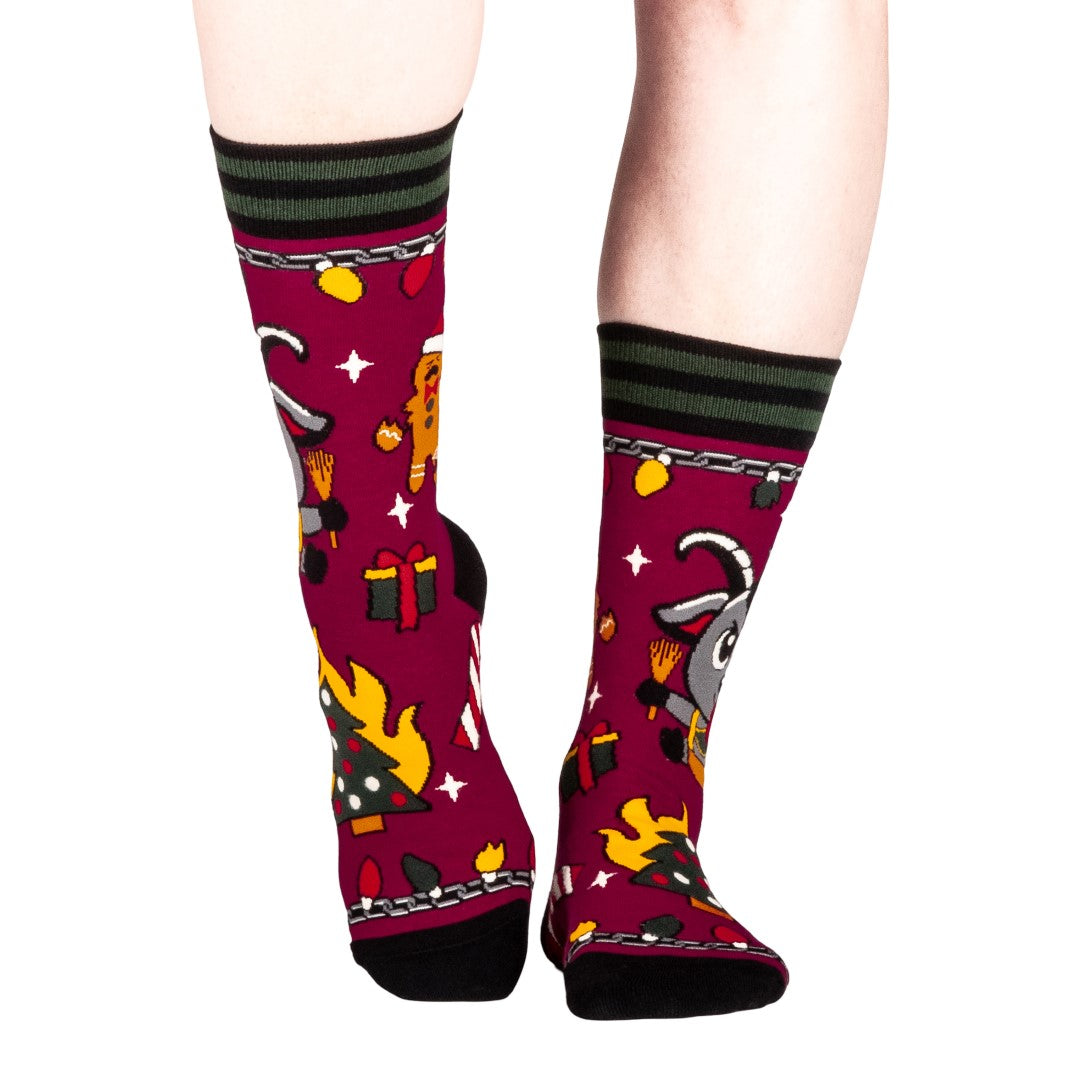 Colorful socks with cartoon Krampus design on a white background
