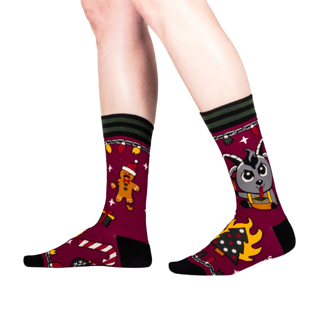 Colorful socks with cartoon Krampus design on a white background
