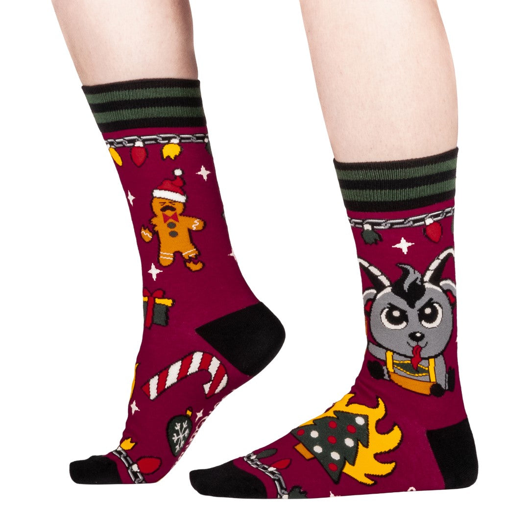 Colorful socks with cartoon Krampus design on a white background