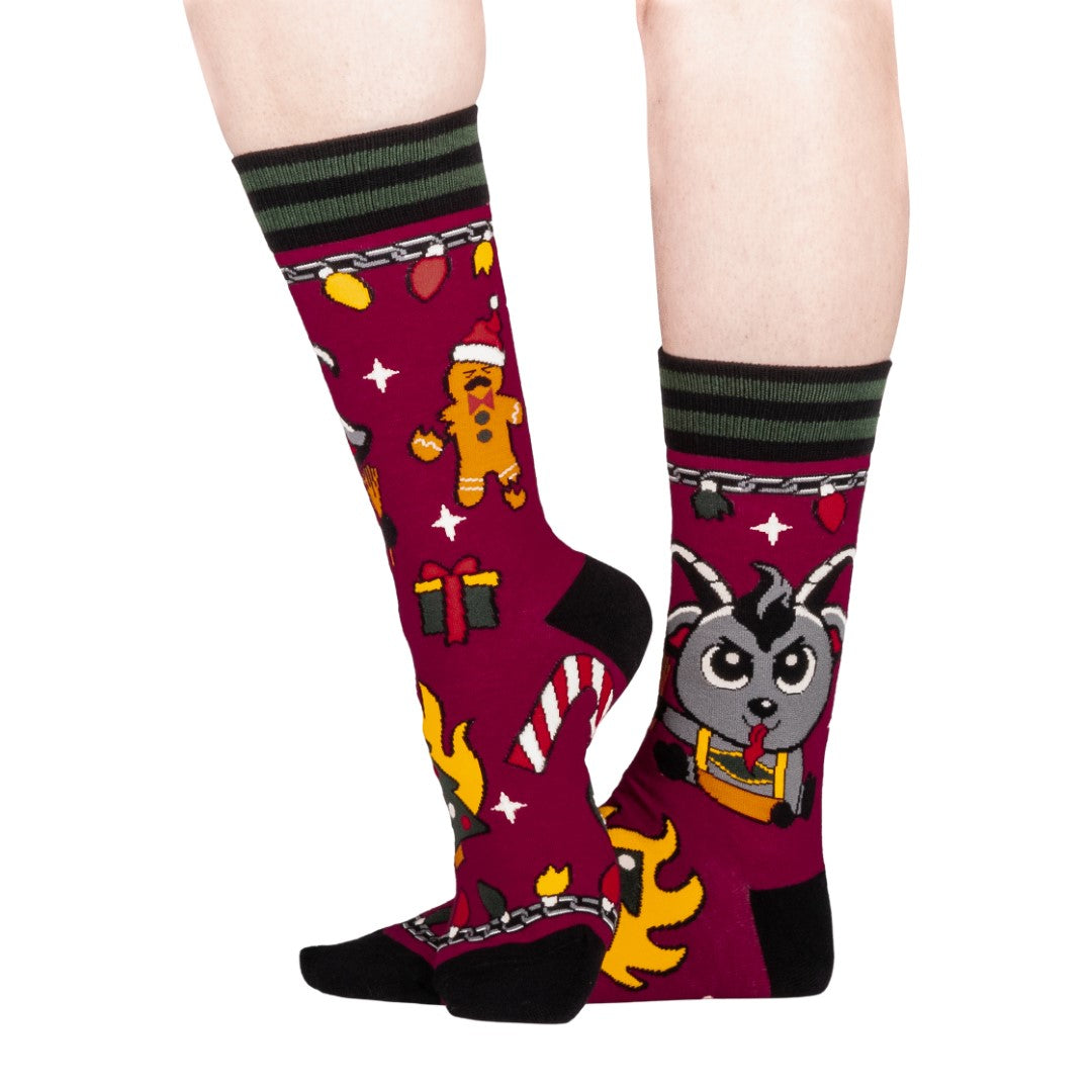 Colorful socks with cartoon Krampus design on a white background