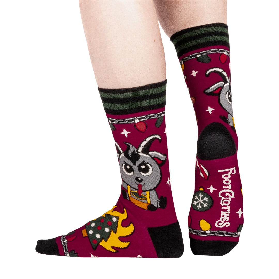 Colorful socks with cartoon Krampus design on a white background