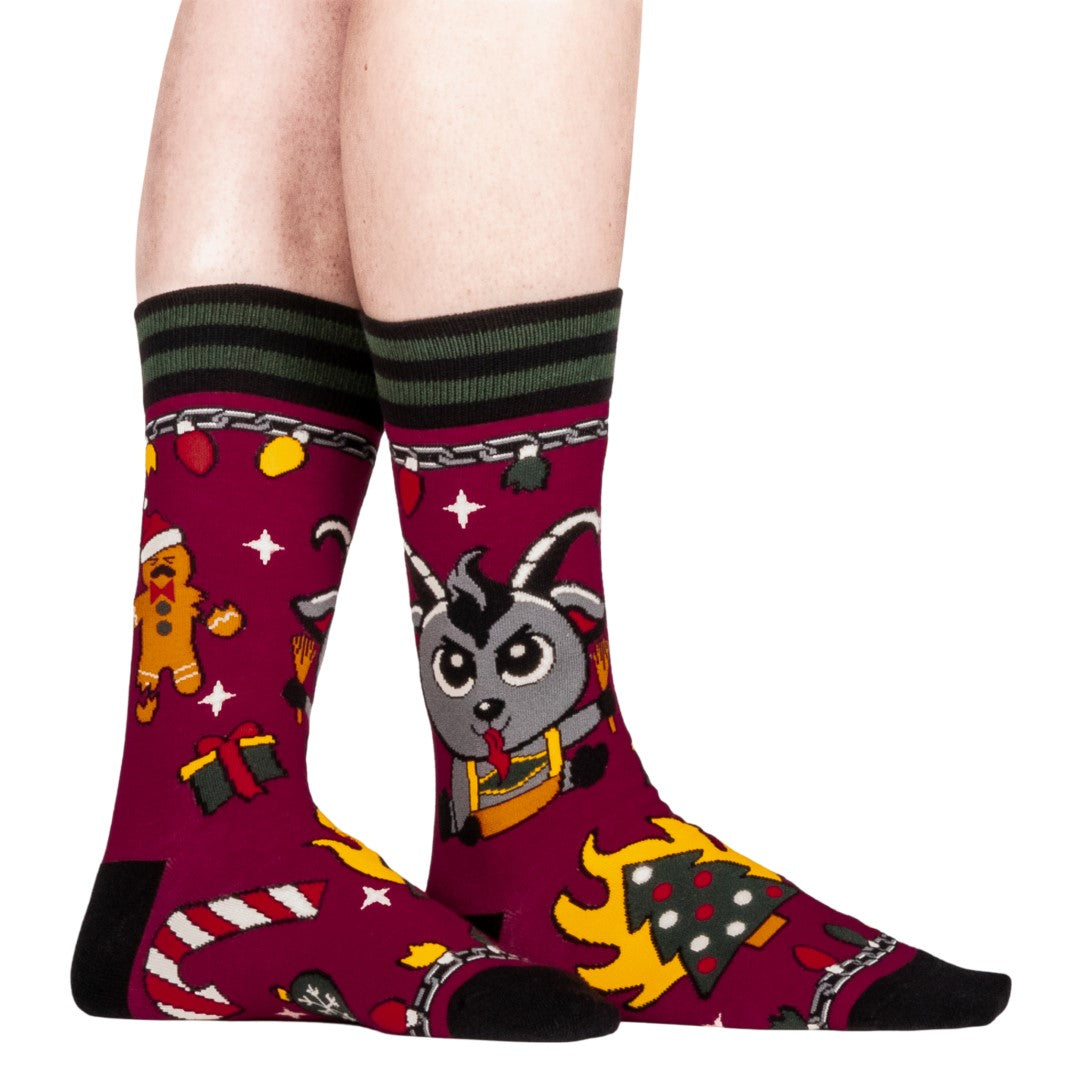 Colorful socks with cartoon Krampus design on a white background