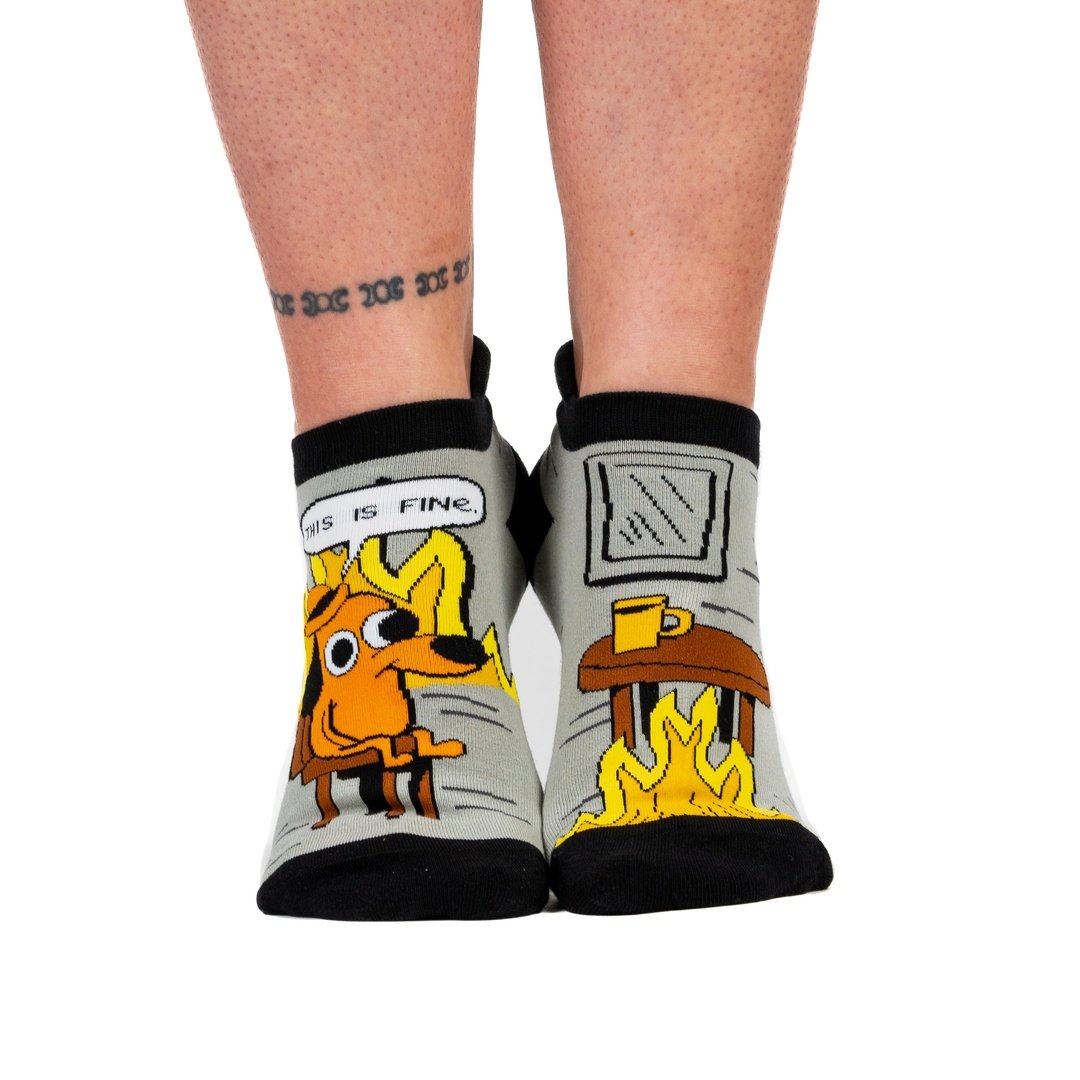 Socks with a cartoon dog and text 'This is fine' on a white background