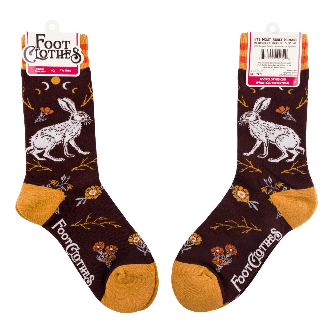 Pair of brown socks with white rabbit design and orange accents, displayed on a white background.