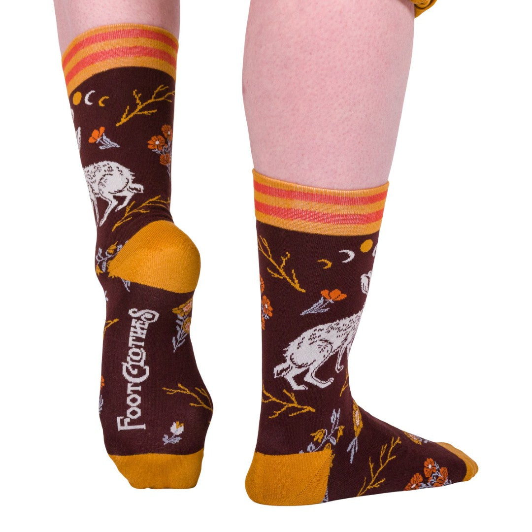 Colorful socks with animal patterns and 'Foot Clothes' branding on a white background