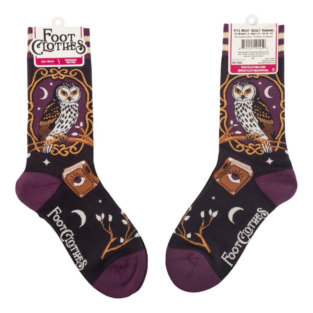 Pair of socks with owl design and 'Foot Clothes' branding on a white background