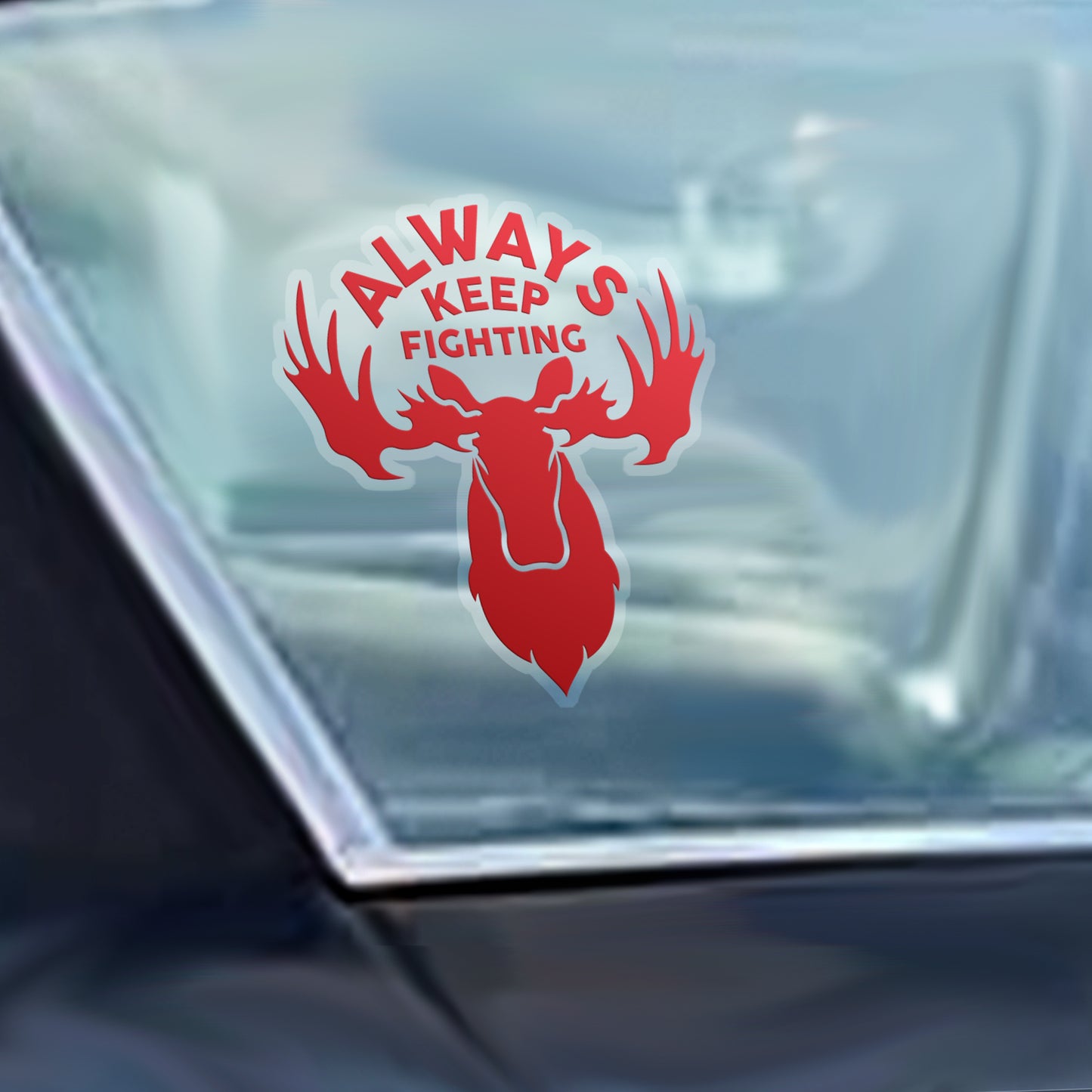 Decorative sticker with 'Always Keep Fighting' text and a moose silhouette on a car window