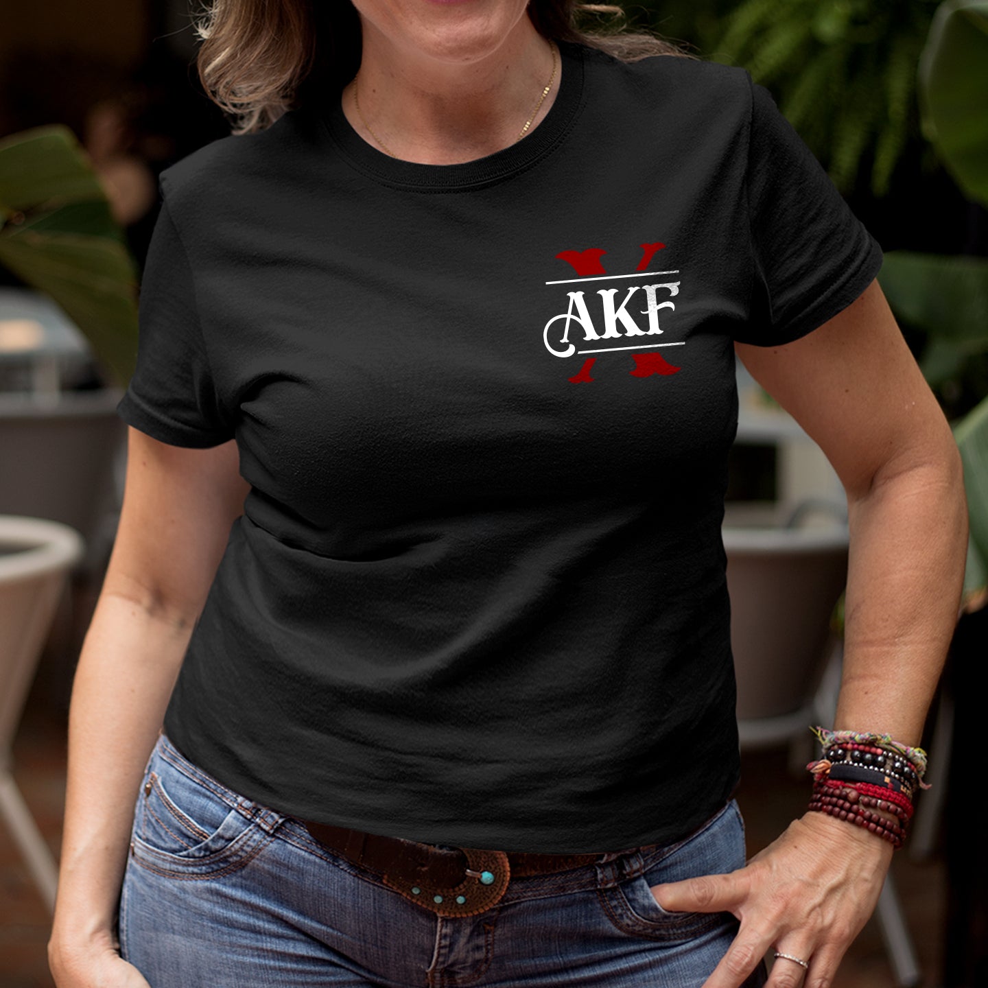 Person wearing a black t-shirt with 'AKF' logo