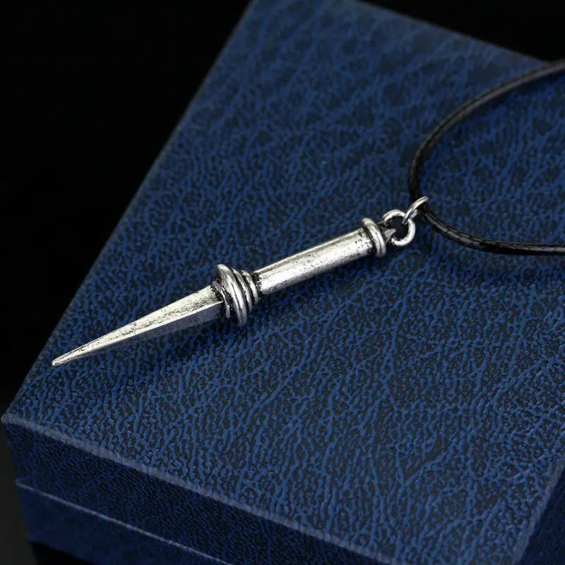 A necklace depicting the Angel Blade from Supernatural