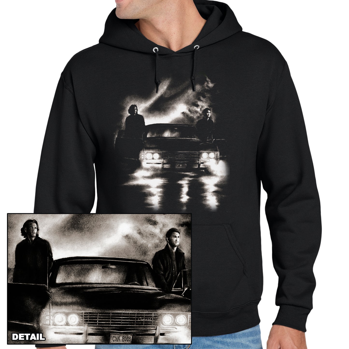 A model in a black hoodie. On the front is a drawing of Sam and Dean Winchester with Baby. Inset is a close up of the drawing.