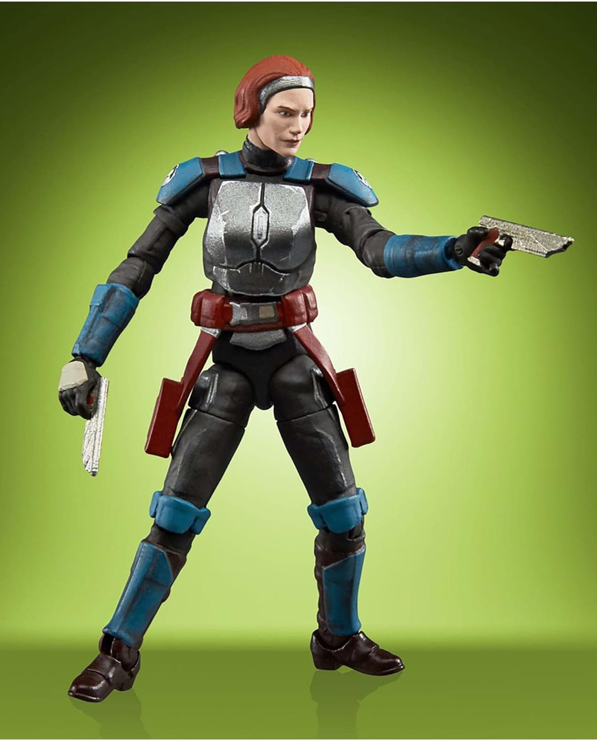 A plastic action figure depicting the character Bo-Katan Kryze from The Mandalorian, against a green background.