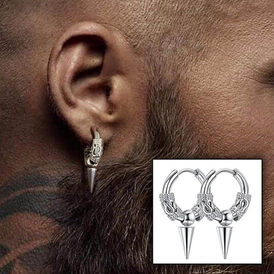 Close up of a model's ear wearing a silver earring. The earring is a hoop, with a cone-shaped pendant hanging from the bottom edge. At each side of the hoop are small textured cuffs, with a snake-shaped section at the center of each. An inset image shows two of the earrings side by side.