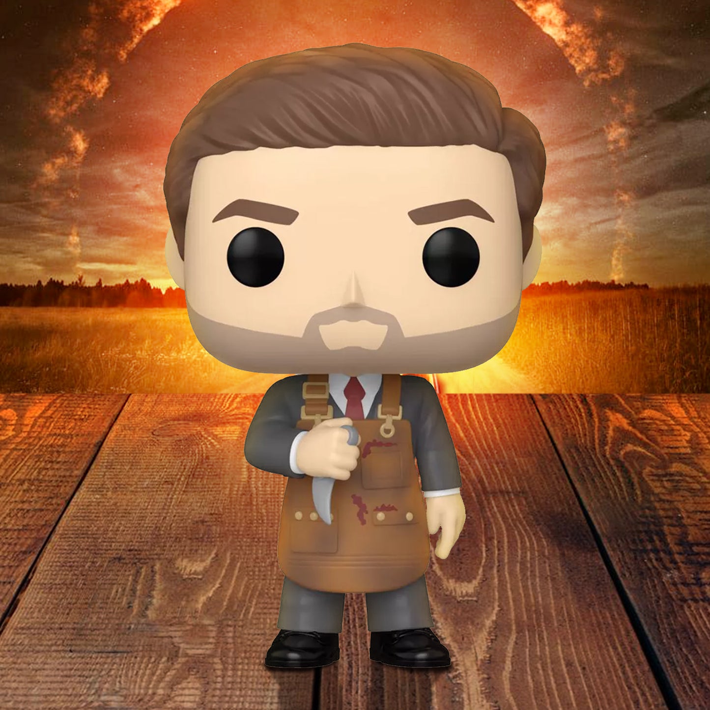 Funko Pop! vinyl figure of the character Dean  Winchester as Michael in a suit and apron on a sunset background