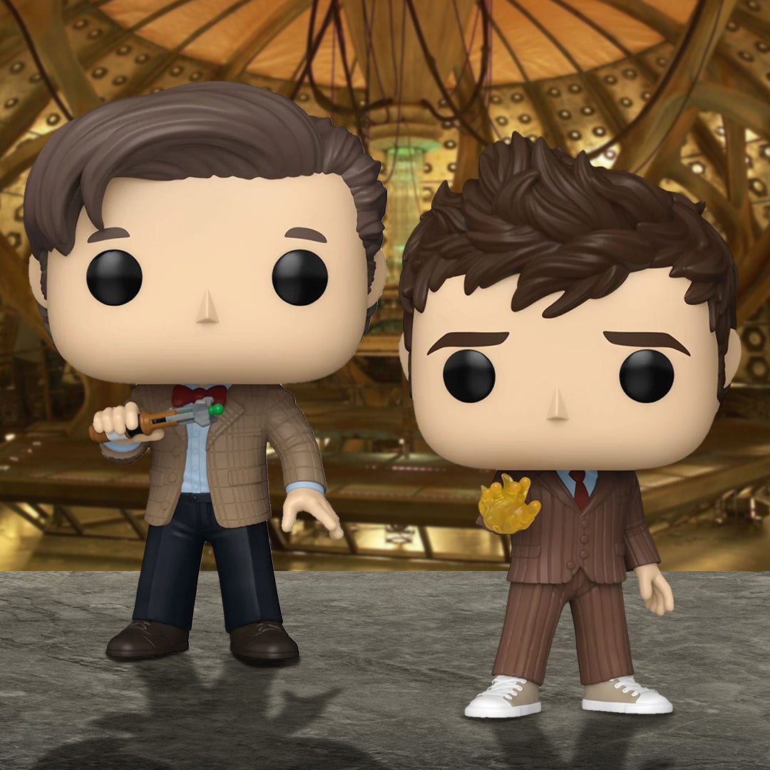 Two Doctor Who pop! vinyl figures of the Eleventh and Tenth Doctors standing in front of a metallic industrial background.
