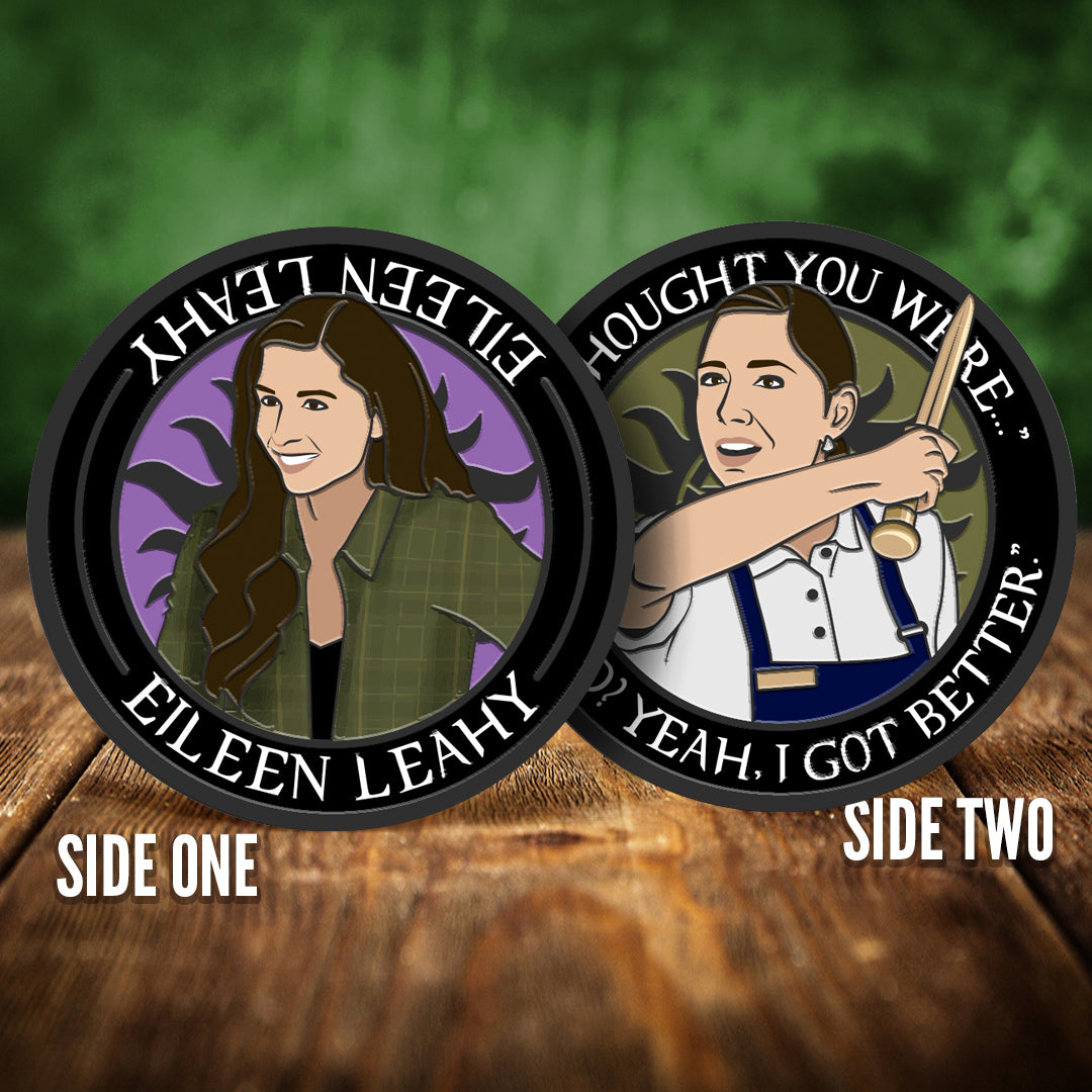 Two coins depicting Eileen, on a wooden surface