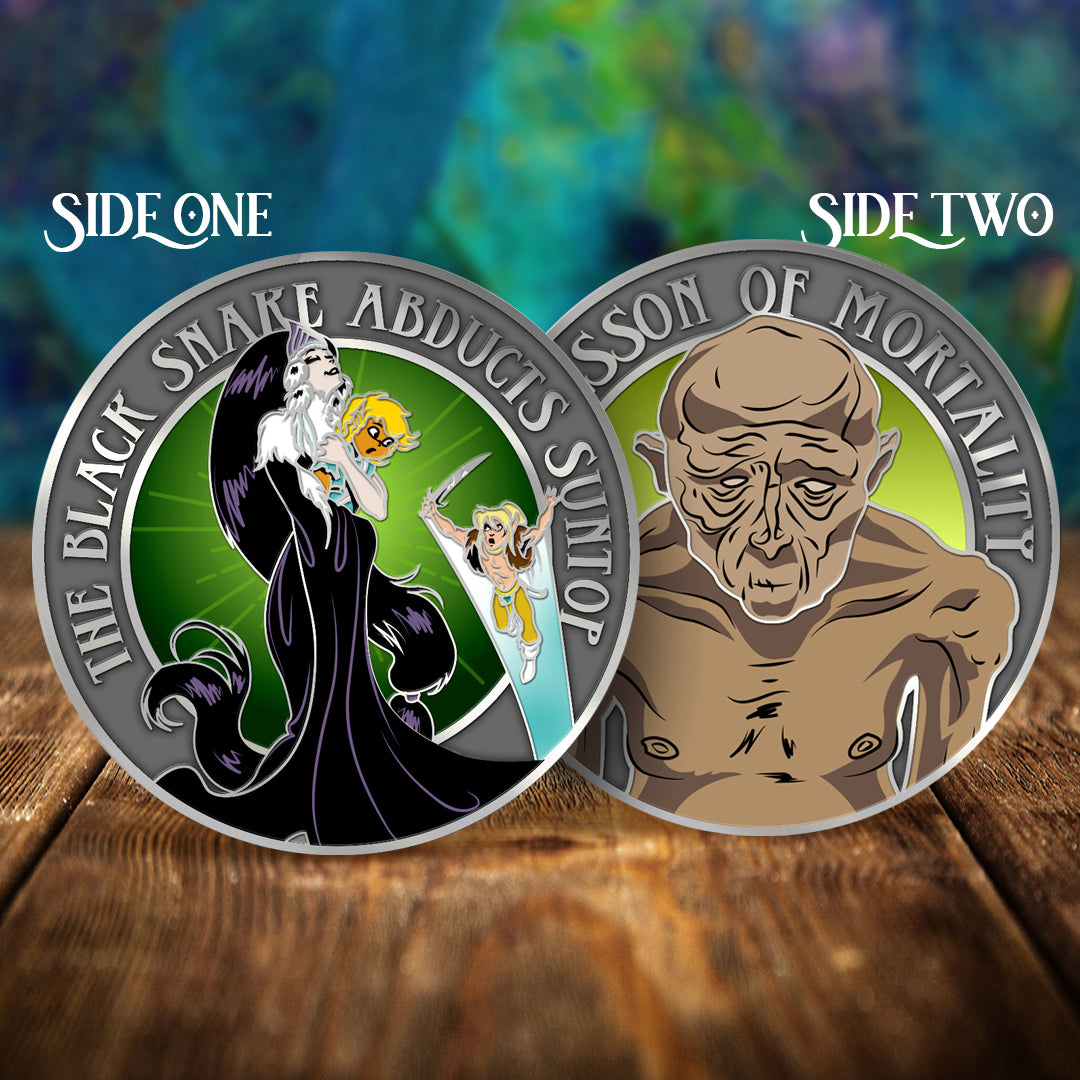 Two circular collectible coins or medallions displayed on a wooden surface against a blurred fantasy background. The left coin reads "SIDE ONE" and shows a dark-robed figure with a yellow snake on a green background.