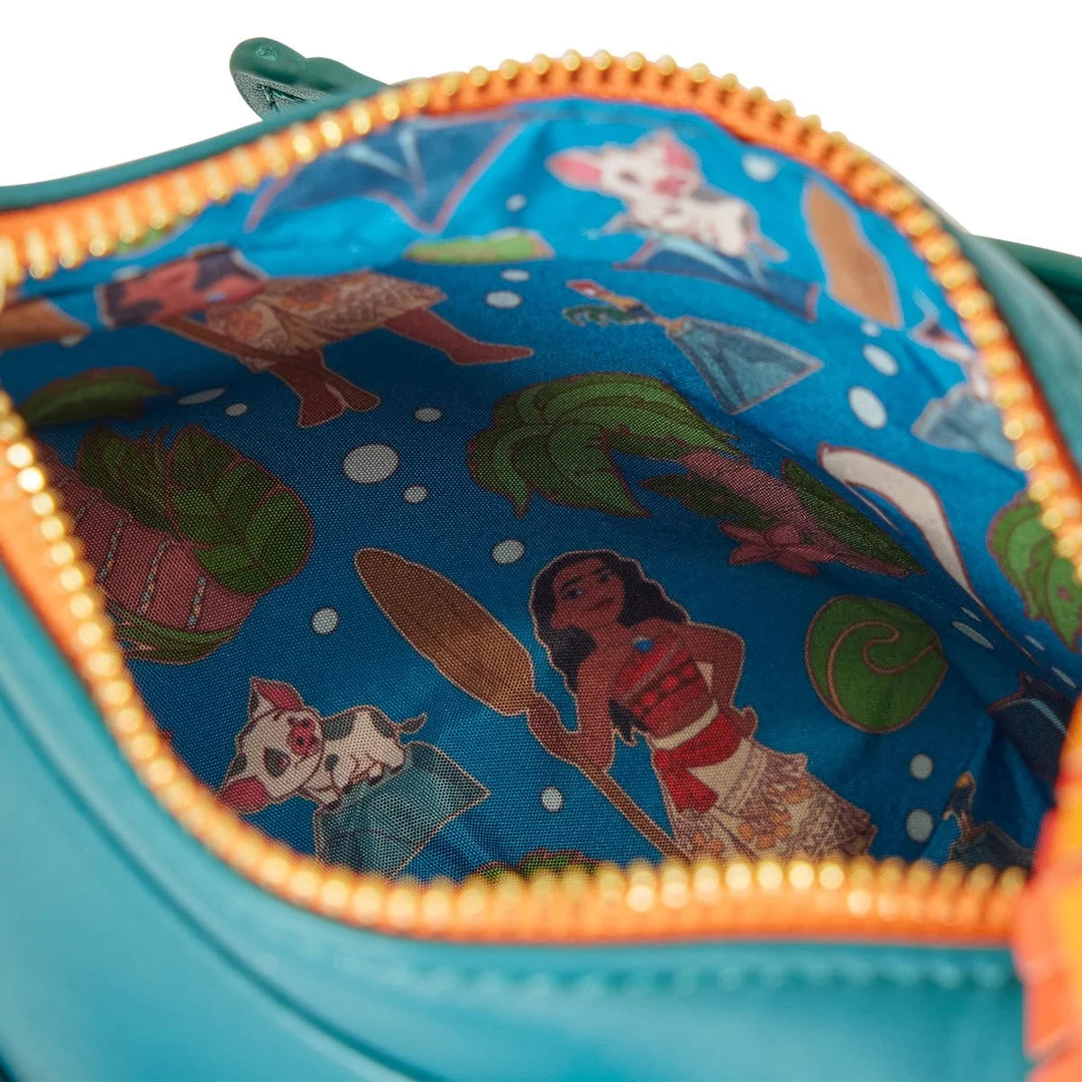 A close up image of the bag's interior, showing a printed pattern depicting characters from Moana.