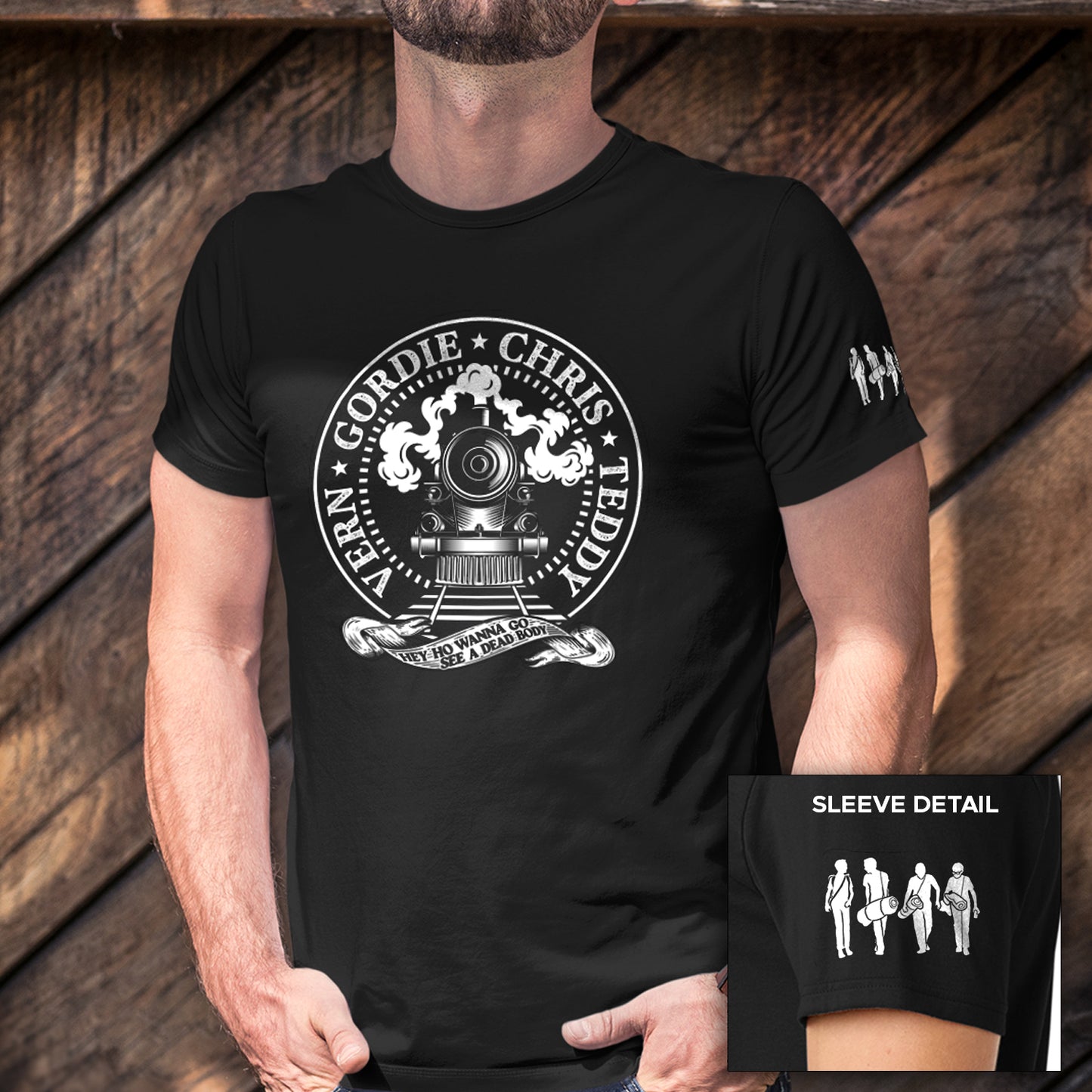 Black t-shirt with white graphic design worn by a person, with sleeve detail shown.