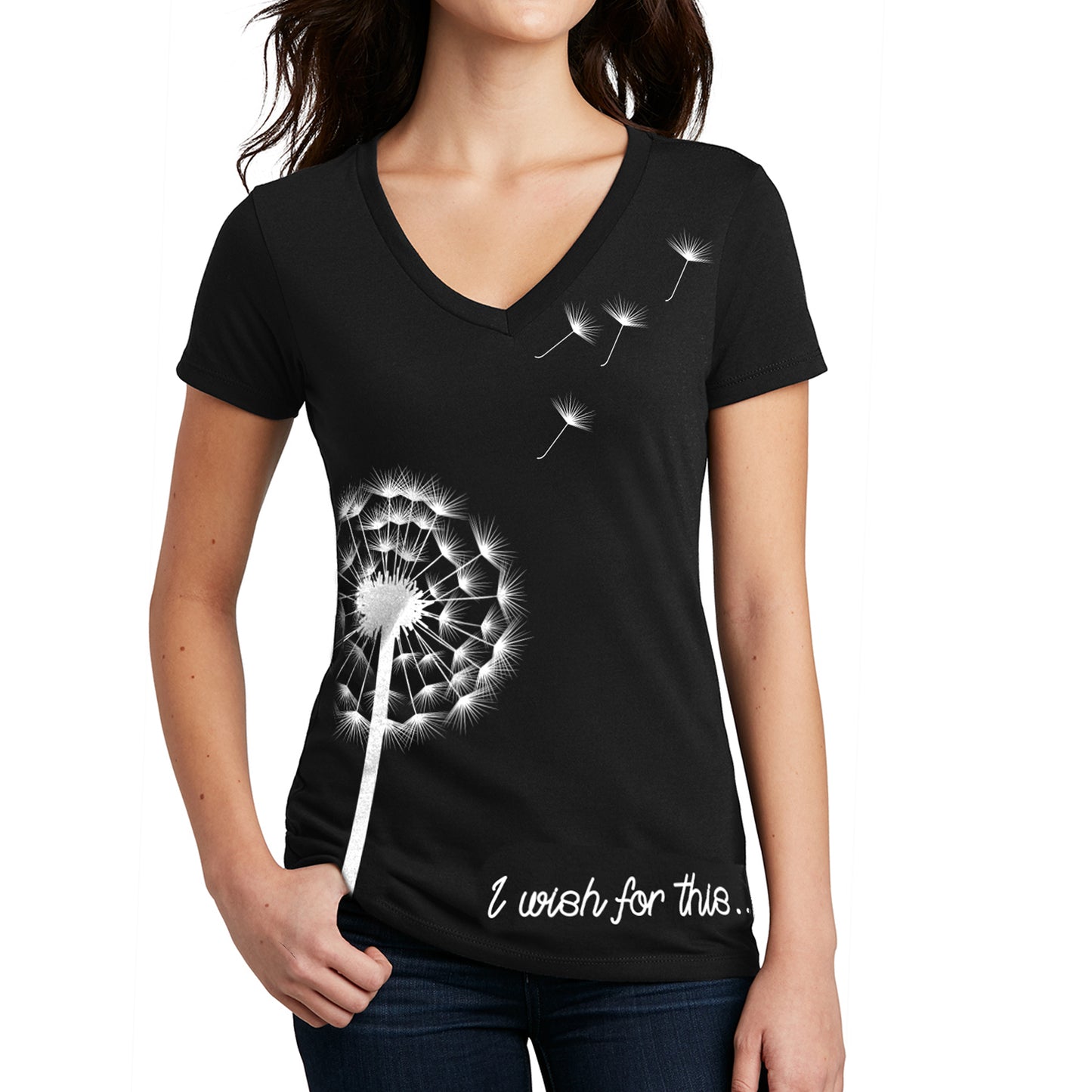 A female model wearing a black V-neck shirt. On the front is a white drawing of a dandelion with four seeds floating off. At the bottom is white scripted text that says I wish for this.