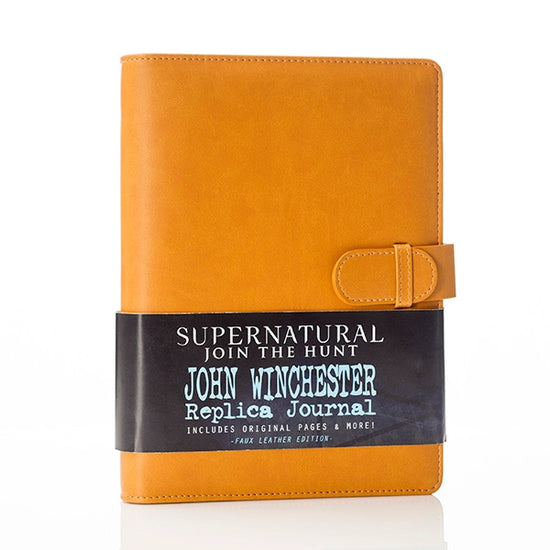 A brown faux leather journal with a locking strap on one side. Across the bottom is a black banner with white text saying "Superntural, join the hunt. John Winchester Replica Journal."