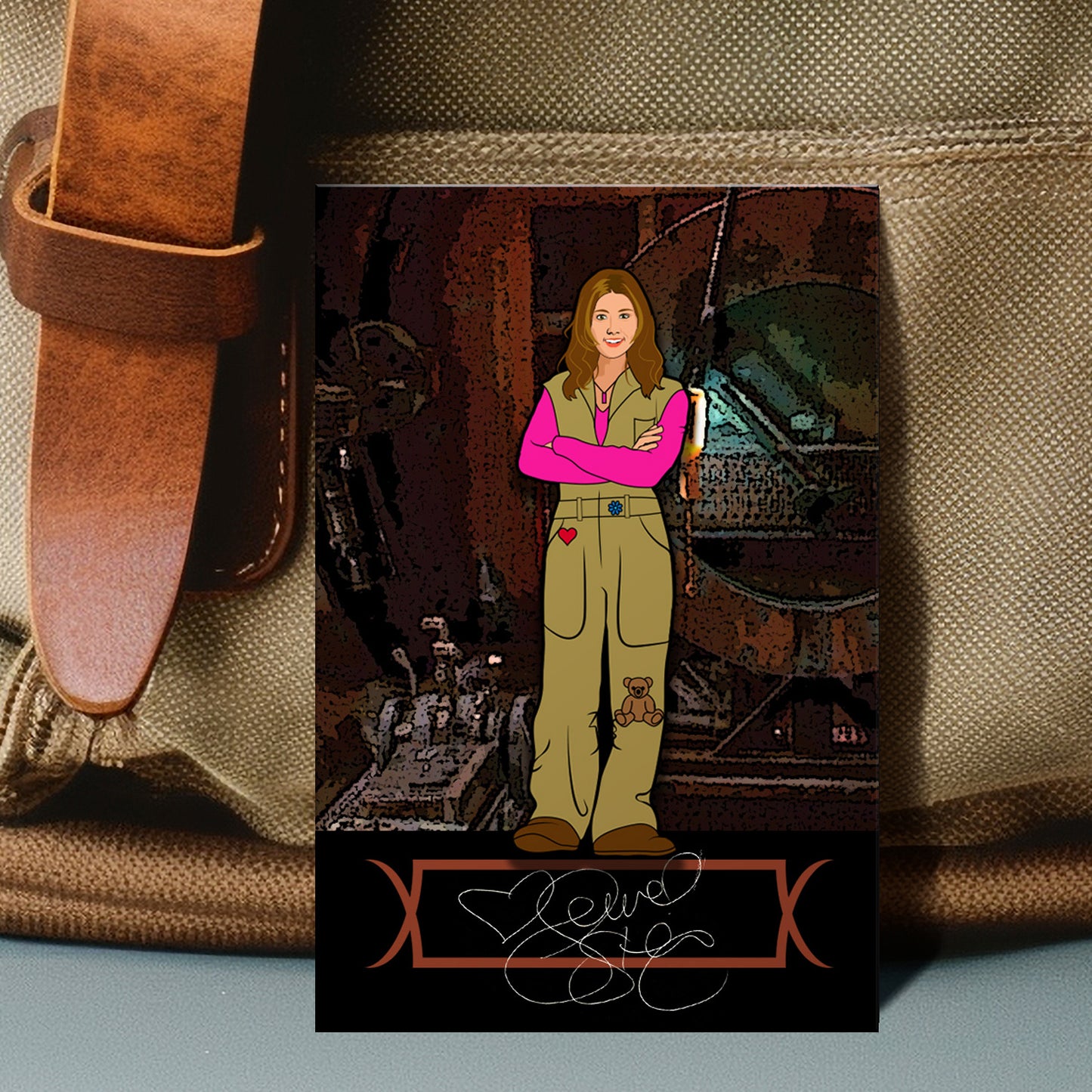 An enamel pin depicting Kaylee Frye against an engine room