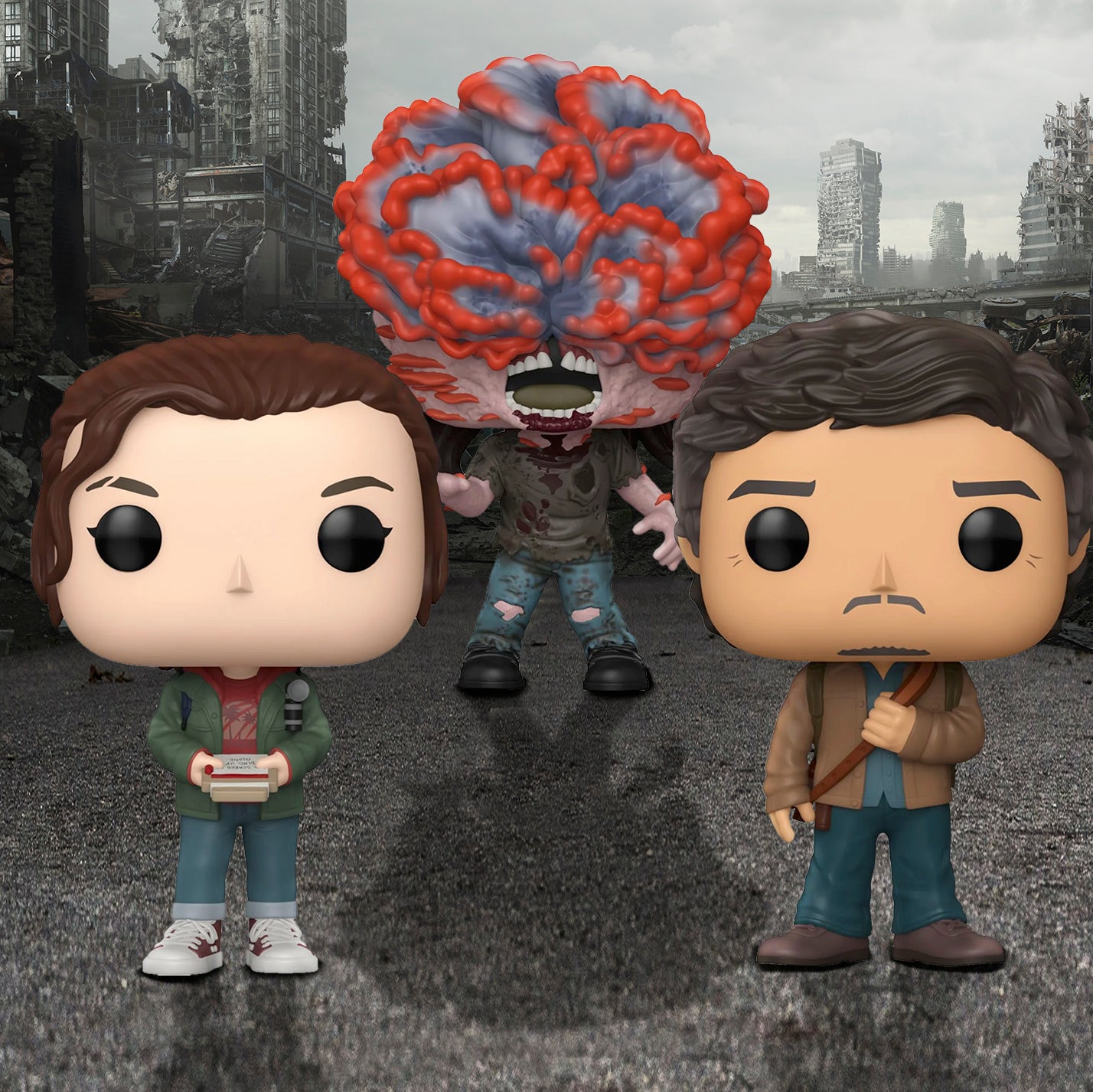 Three bobblehead figures depicting characters from the TV series "The Last Of Us" on a street. In the background is a crumbling city