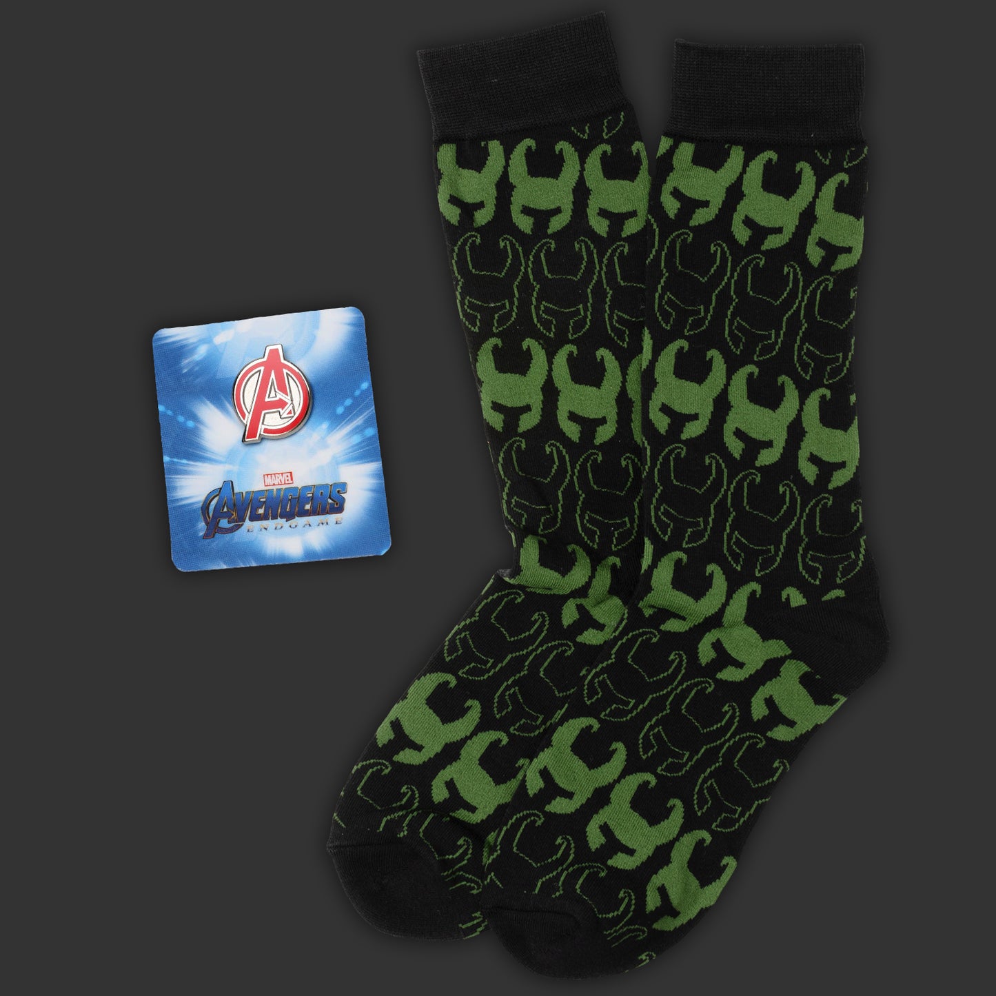 Green and black patterned socks with a Marvel Avengers card on a dark background