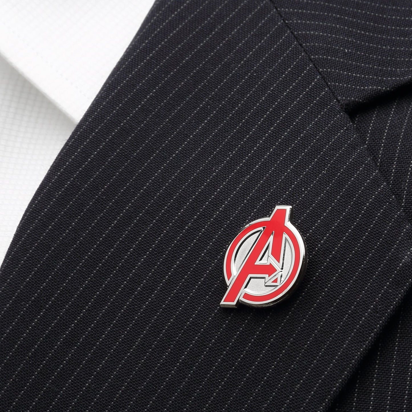 Avengers logo pin on a black pinstripe suit jacket