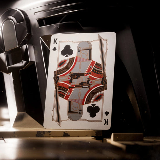 A King of Clubs playing card. The image of the King has been replaced by The Mandalorian.