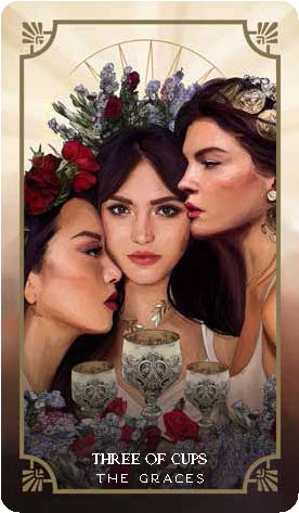 A tarot card from the deck, depicting the graces from greek mythology, with text saying "three of cups."