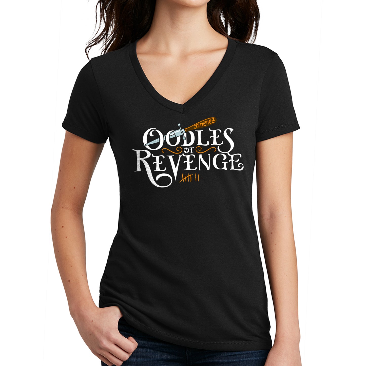 An image of a female model in a V-neck shirt. The front of the shirt has white text that says "Oodle of revenge." Above the text is a drawing of a dagger, with the blade sticking through the openings of the two Os in oodles. Under the text are orange tally marks, counting to 7. 