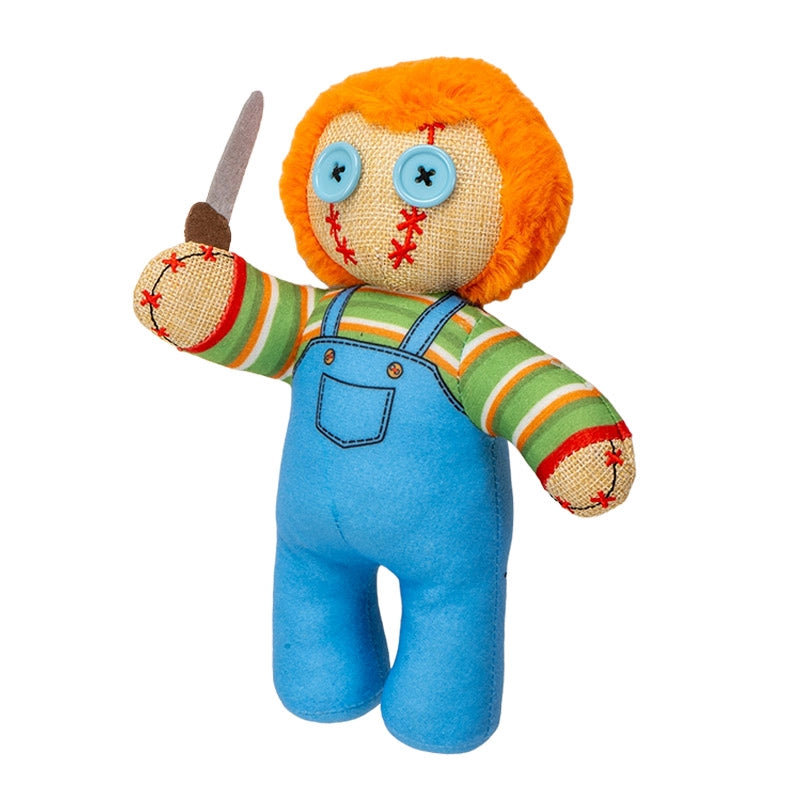 Toy figure with orange hair, striped shirt, blue overalls, and a knife on a white background