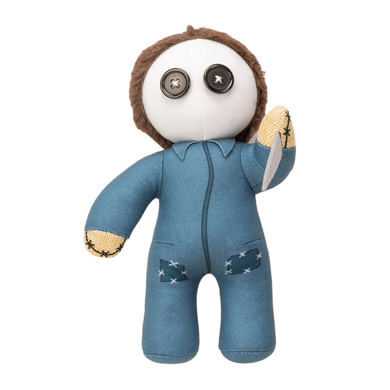 Stuffed toy with a white face, brown hair, and blue jumpsuit on a white background