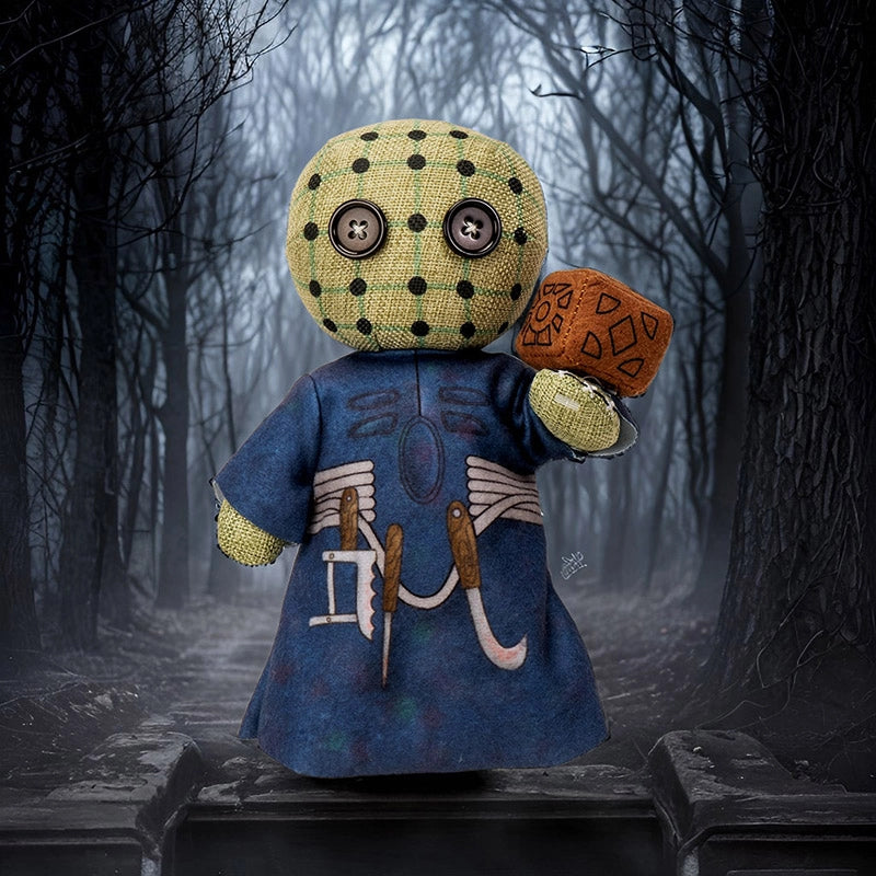 Stuffed toy with a blue coat and yellow head in a dark forest