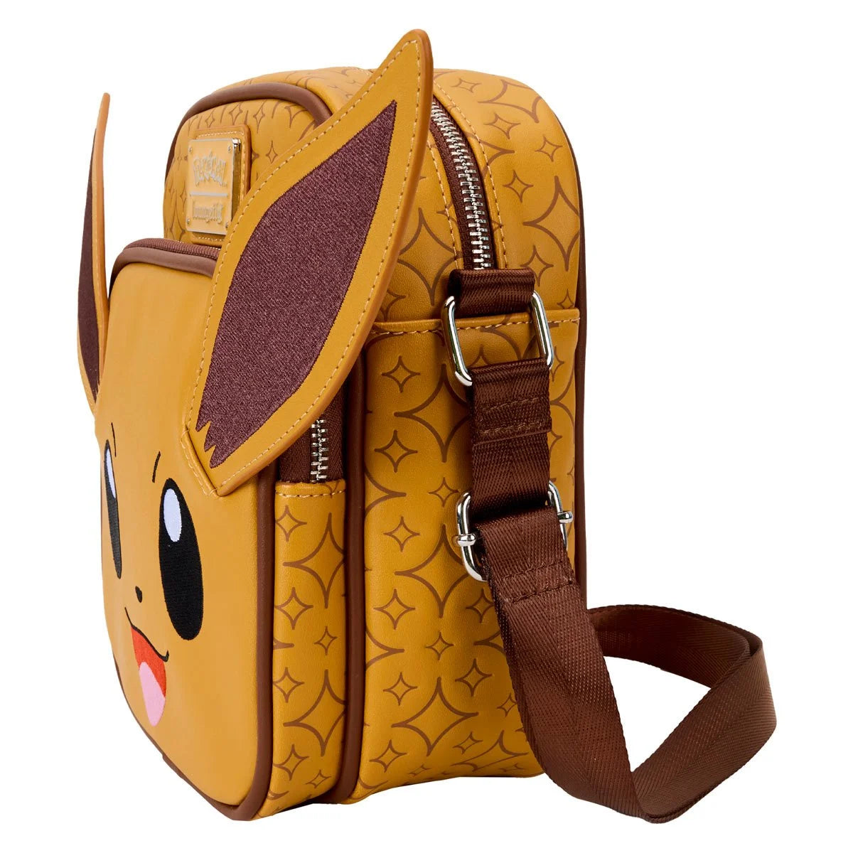 Side view of a yellow nylon backpack depicting the Pokemon character Eevee on the back, with long brown ears sticking up at the top corners. The backpack has two large black eyes with white dots, and a red and pink mouth. At the top is a metal sticker with "Pokemon, Loungefly" printed on it. A brown fabric strap is attached at the top side. A metal zipper is at the top of the bag.