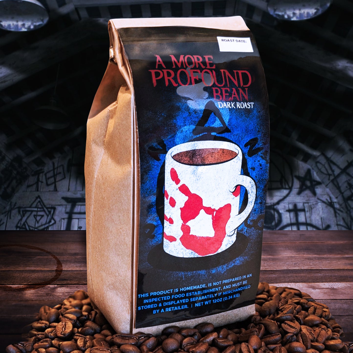 A package of SPN 'A More Profound Bean' Darkroast Coffee with a graphic of a white coffee cup with a red design on a brown background, surrounded by coffee beans and supernatural-themed artwork.