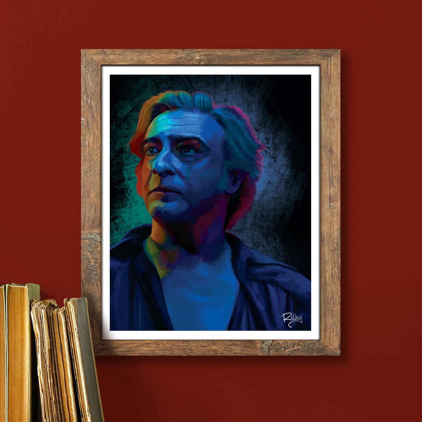 A framed lithograph on a red wall. The lithograph depicts the character Stede from Our Flag Means Death.