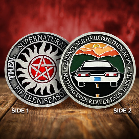 Front and back views of a brass coin. On the front is the anti-possession symbol in silver and red. Around the edge of the coin, raised text says "Supernatural, Fifteen Seasons. Then... Now..." The back of the coin depicts the back of a black 1967 Chevy Impala driving on a black road toward a sunset. Around the edge is raised text saying “Endings are hard, but then again nothing ever really ends, does it?" Behind the coins is a swirling red background.