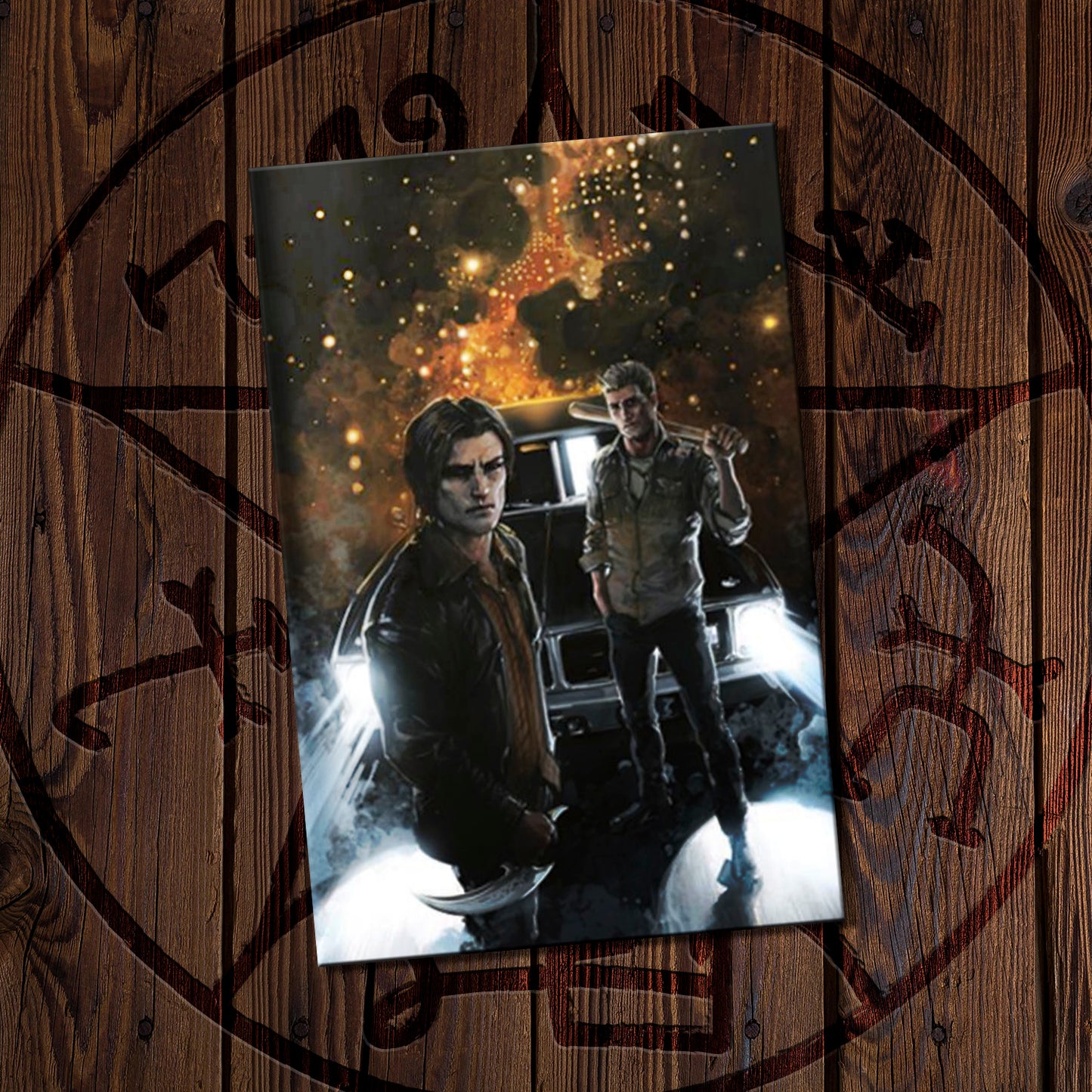 Poster of Sam and Dean Winchester in a dark, urban setting on a wooden surface with decorative elements.