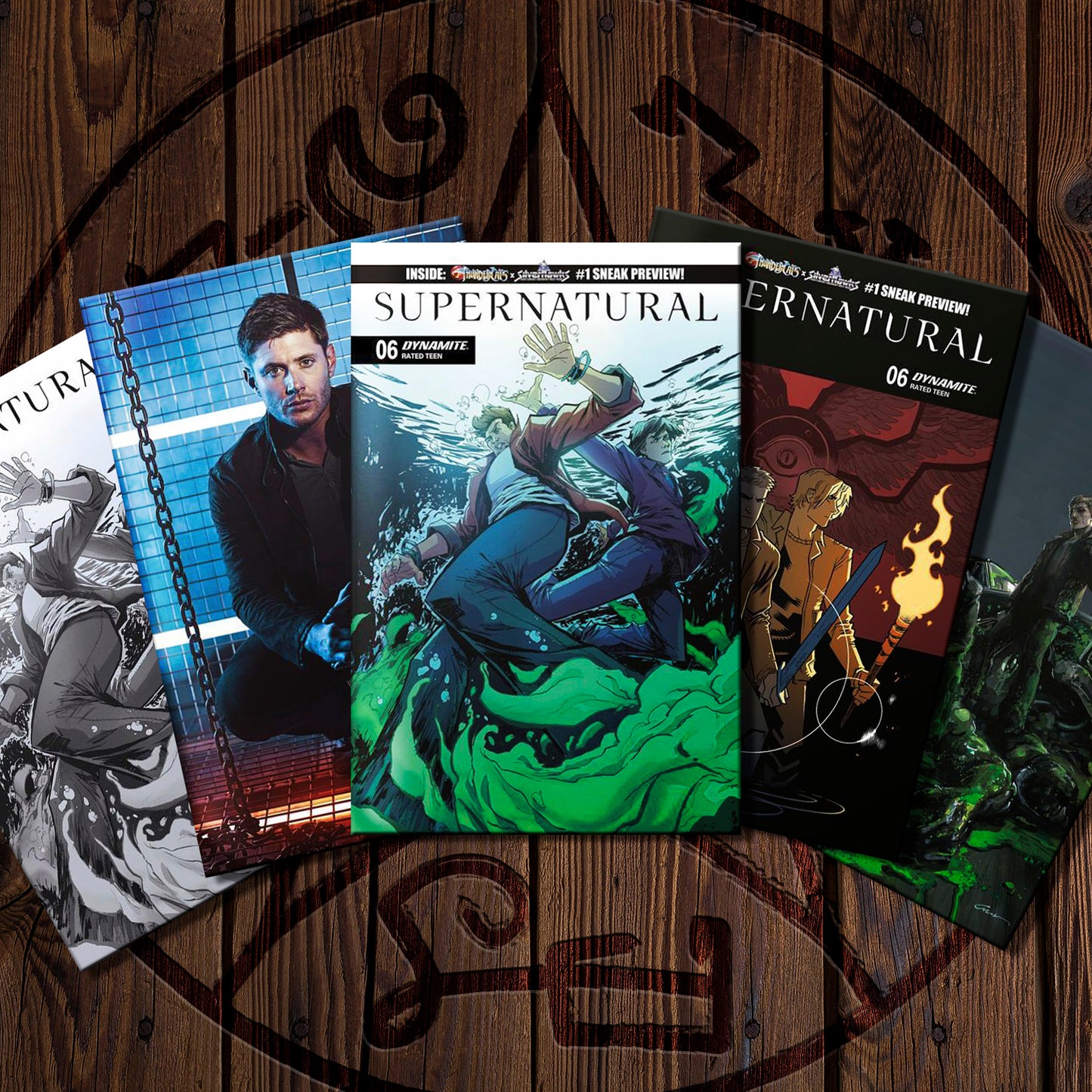 Supernatural comic books on a wooden surface with a circular design.