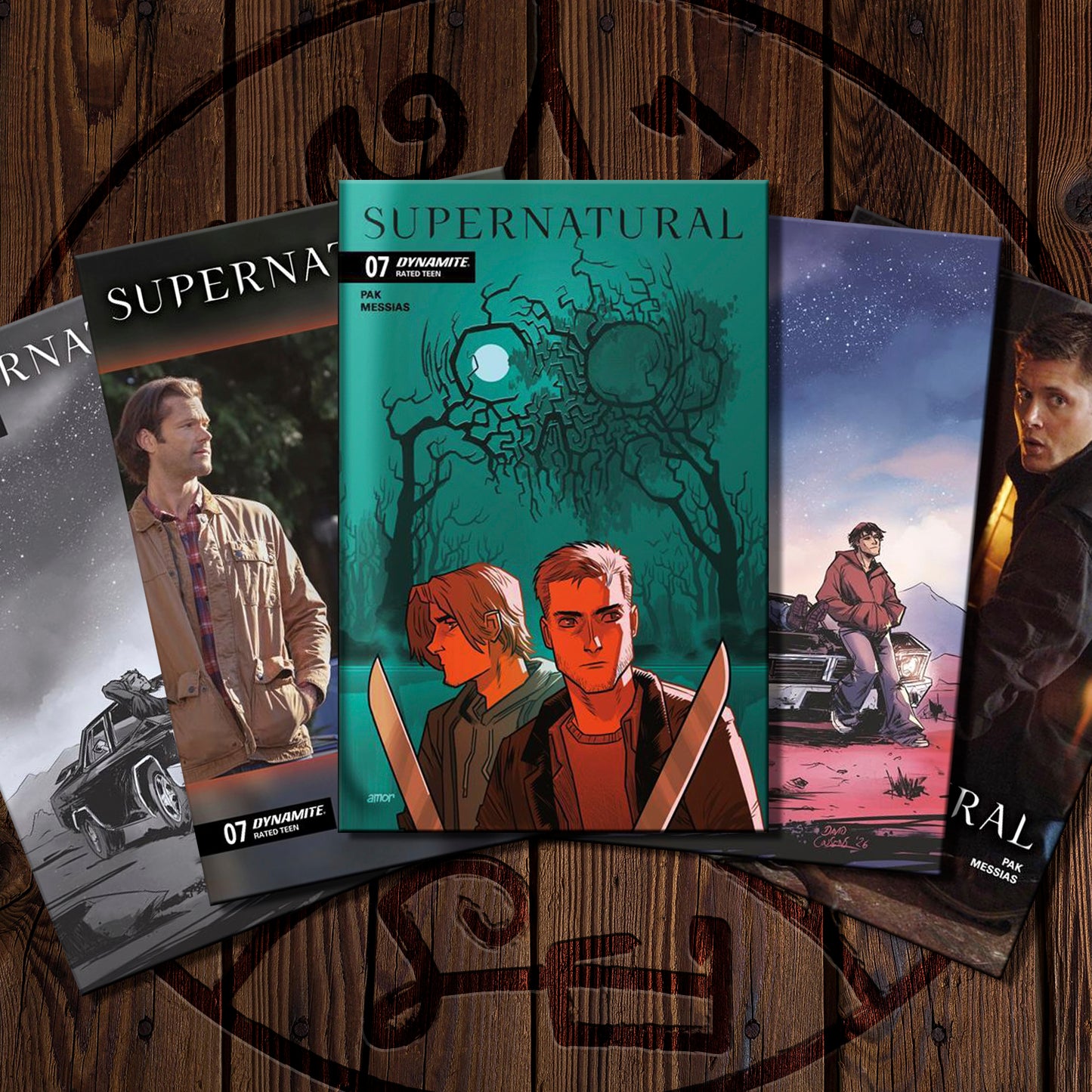 Supernatural comic books on a wooden surface