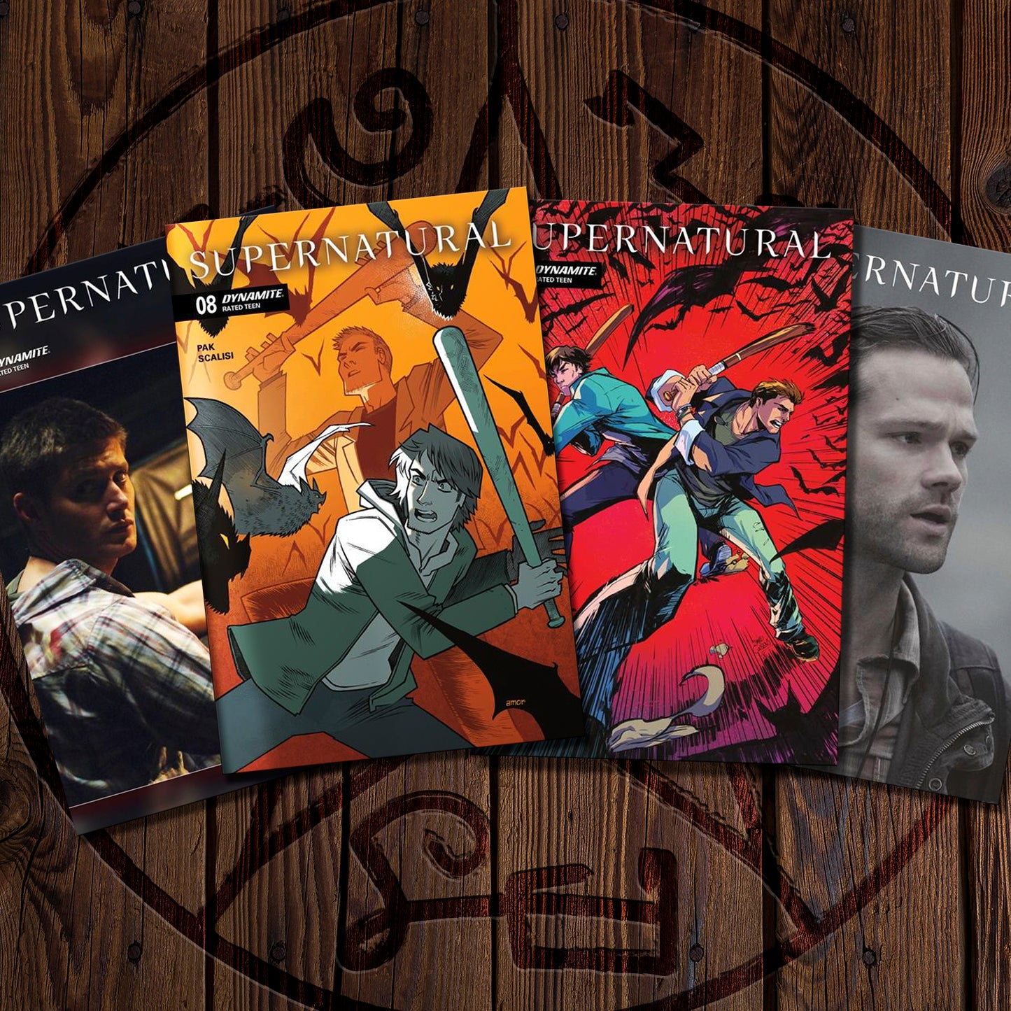 Four comic books featuring 'Supernatural' on a wooden background with a circular design.