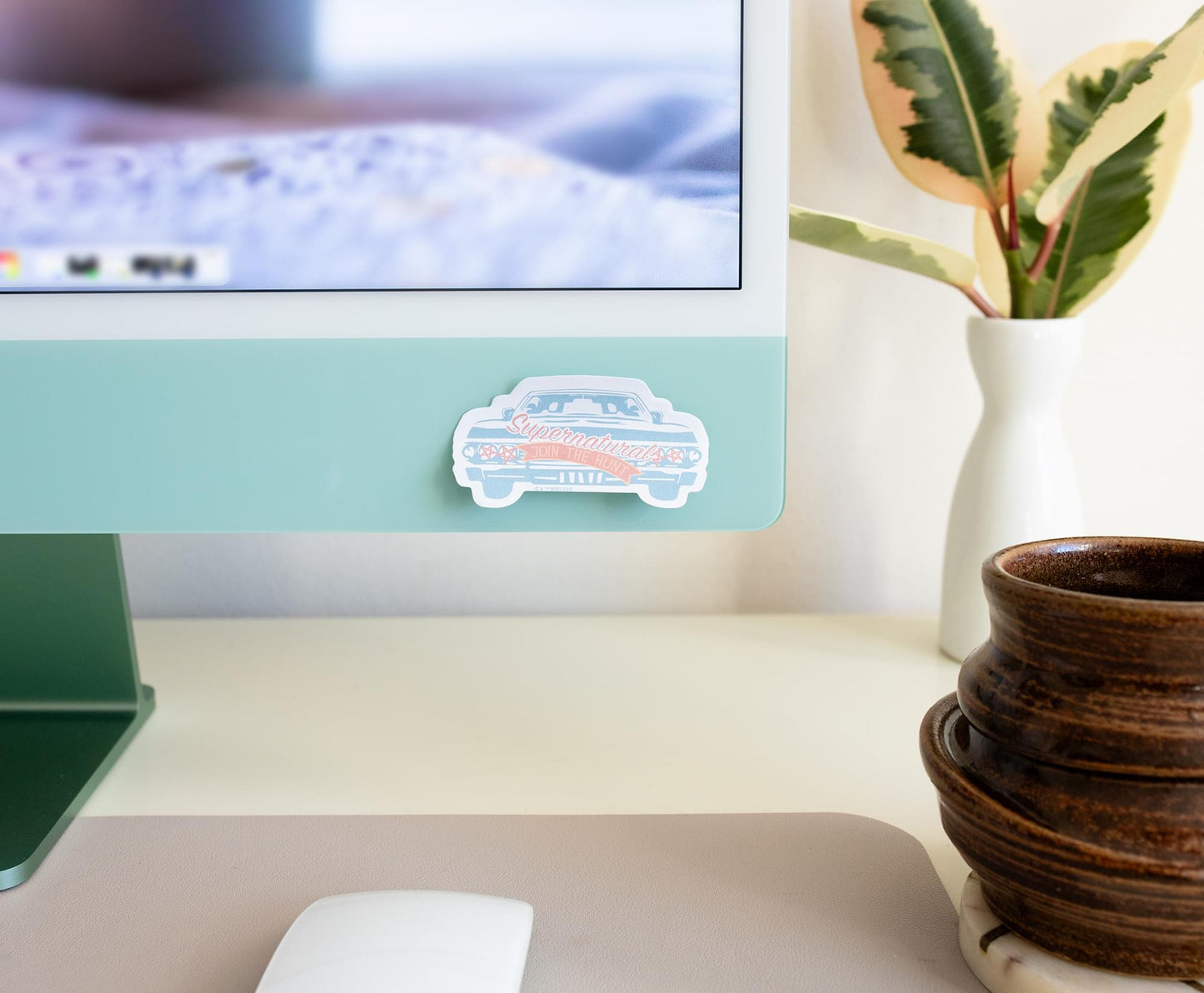 A sticky note depicting Baby on a computer monitor.