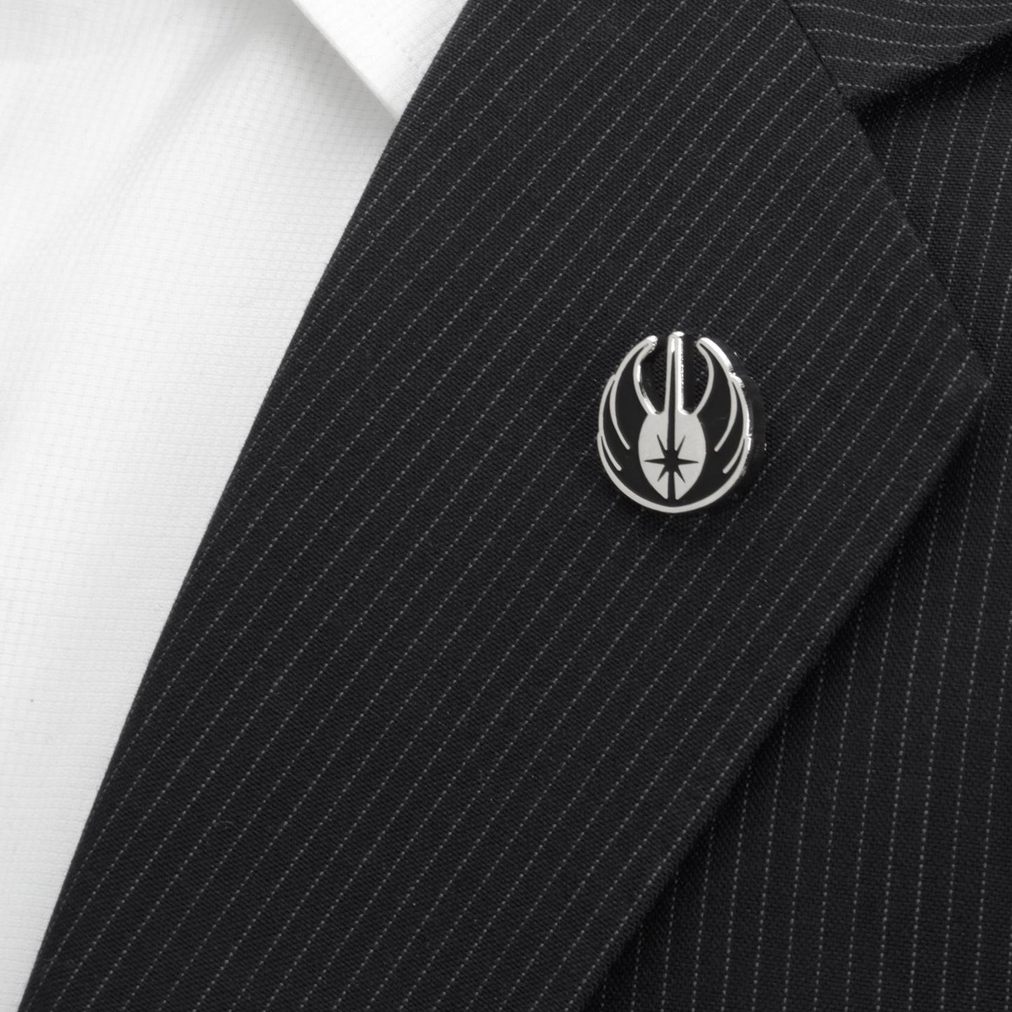 Silver and black Jedi Crest lapel pin on a black pinstripe suit