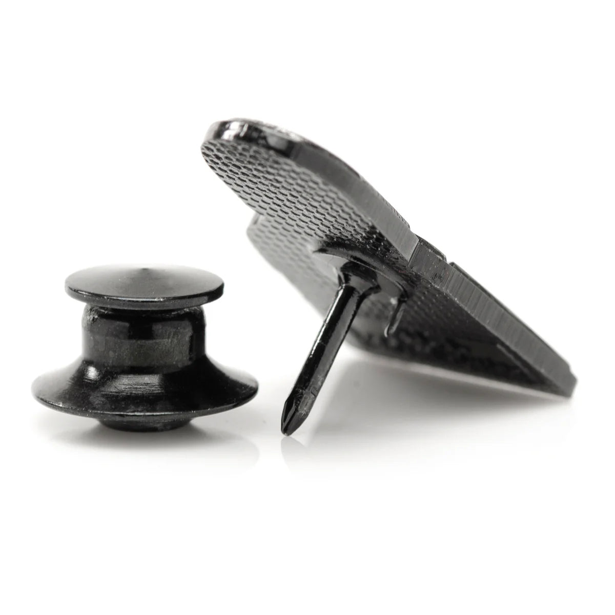 A black and silver lapel pin depicting Grogu and The Mandalorian