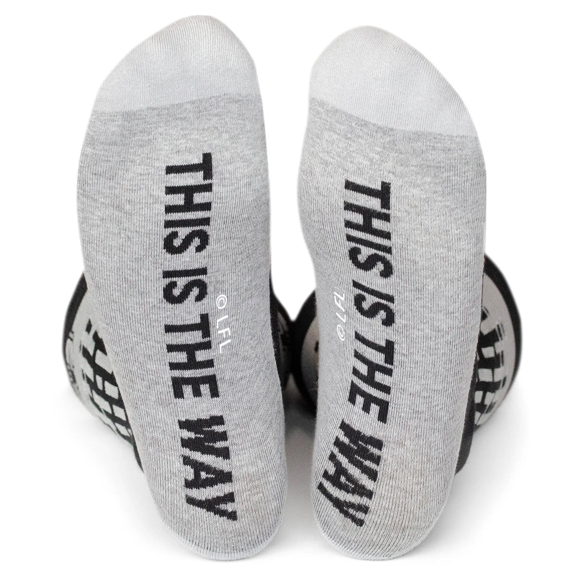 Gray socks with 'This is the Way' text on a white background