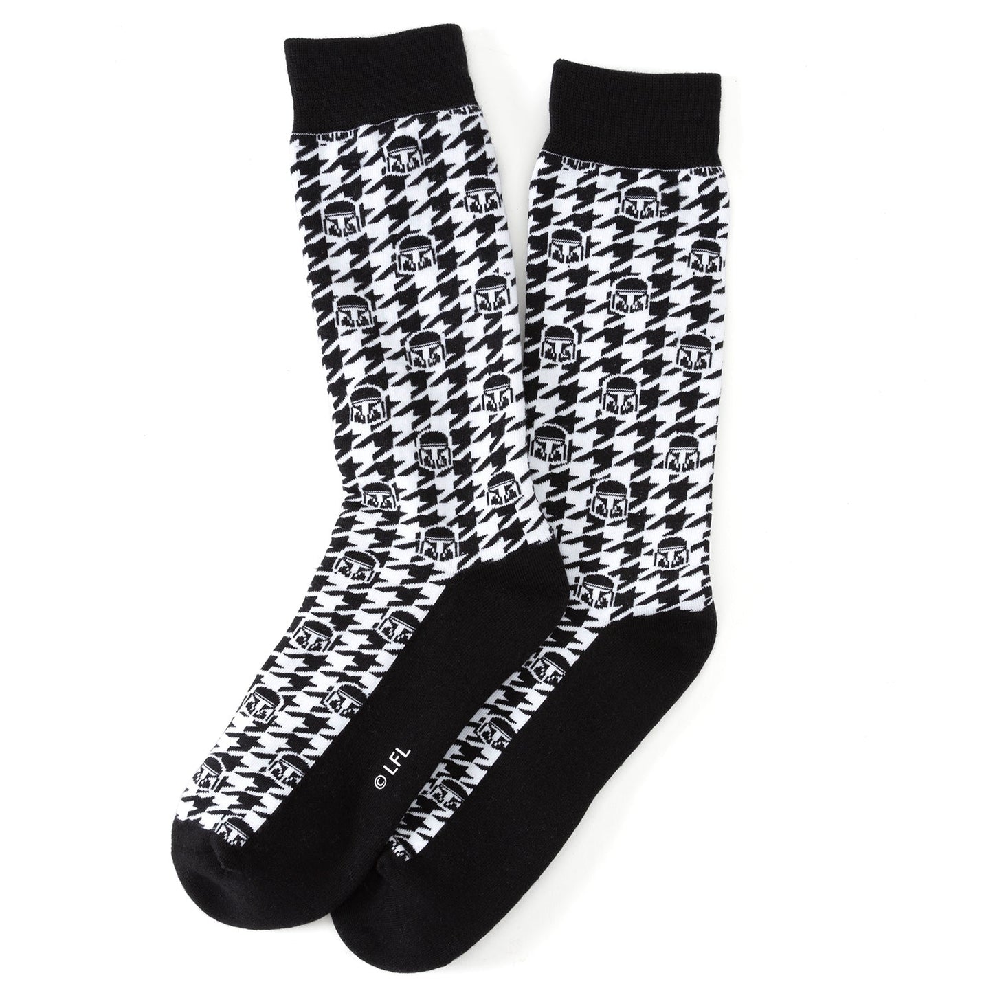 A pair of black and white Mandalorian-themed socks o a white background